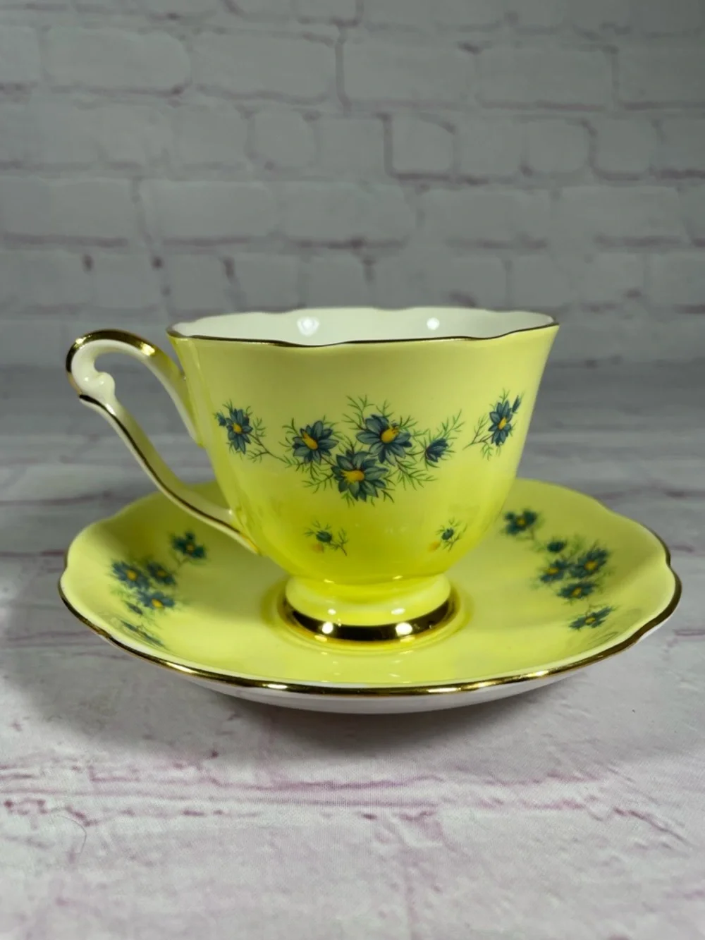 Vintage Yellow and Blue Floral Gold Trim Bone China Footed Teacup and Saucer Set